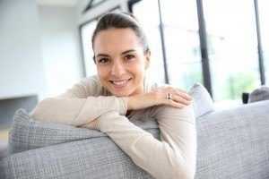 woman couch couch real estate agent fees NSW