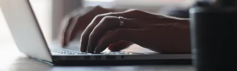 Person typing on a laptop