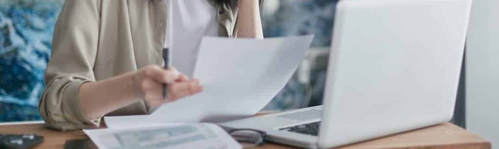 A homeowner reviewing legal documents related to conveyancing